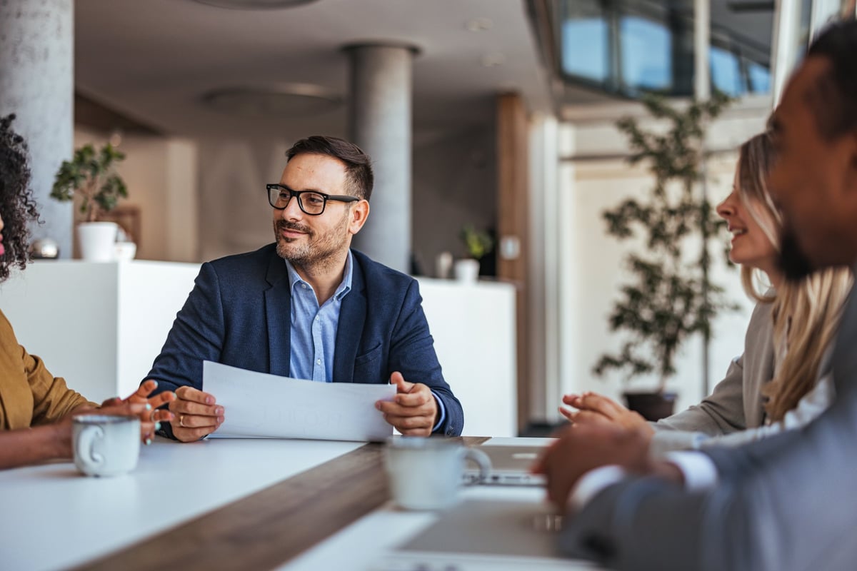 Diverse team engaging in productive business meeting in modern office for strategic planning