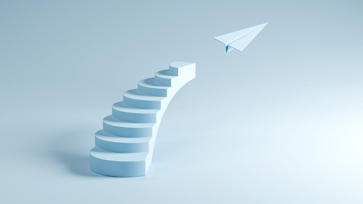 Stairs Leading to Flying Paper Plane - Success, Growth, and Freedom, 3D Render