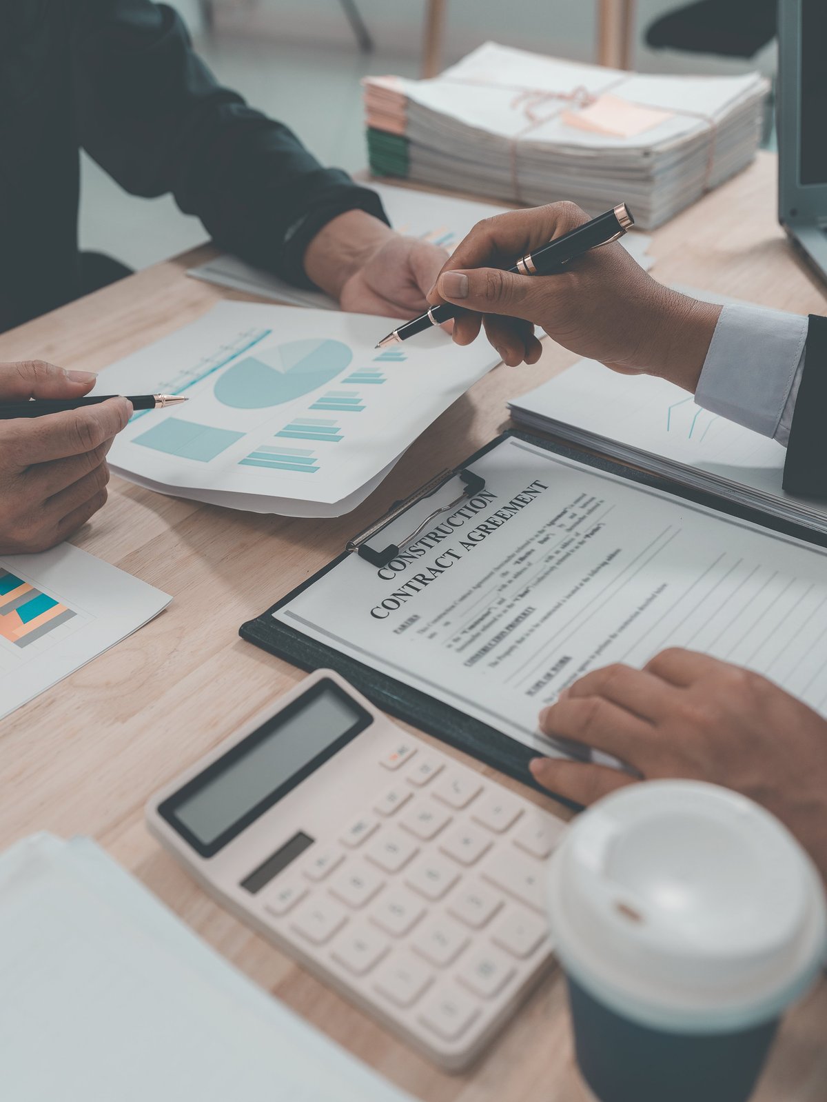 Meeting discussing charts and graphs showing business growth results and financial performance analysis