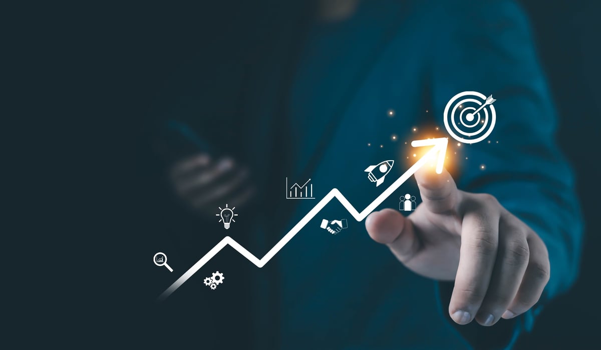 A businessman touching a glowing upward arrow with strategy icons